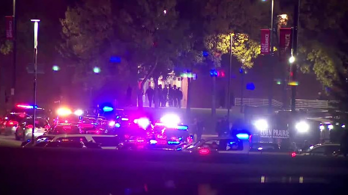 Police respond outside Eden Prairie High School after a shooting during the homecoming football game