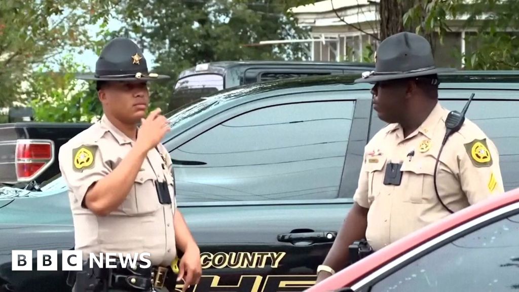 Georgia officials hunt for suspect in shooting that killed two and injured 35 - BBC