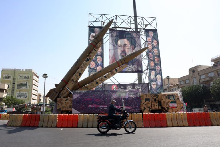 epa13267846 An Iranian man drives past Iranian Zolfaghar missiles placed in front of a billboard carrying a picture of Iranian Supreme Leader Ayatollah Mojtaba Khamenei at Baharestan Square in downtown Tehran, Iran, 28 September 2026. US President Donald Trump turned down Tehran's recent proposal to reopen the Strait of Hormuz. EPA/ABEDIN TAHERKENAREH RESTRICTIONS: NO Access Israel Media/Persian Language TV Stations Outside Iran/Strictly No Access BBC Persian/VOA Persian/Manoto TV/Iran International TV. (As mandated by Iran's Directorate General for Foreign Media) --