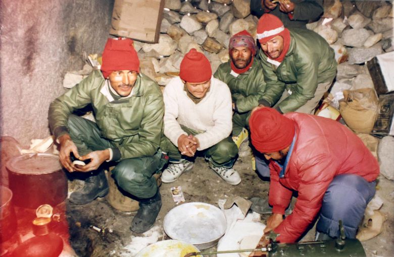 Dorje Morup (third from left) and team members preparing food while on the Indian expedition to Everest in 1996.