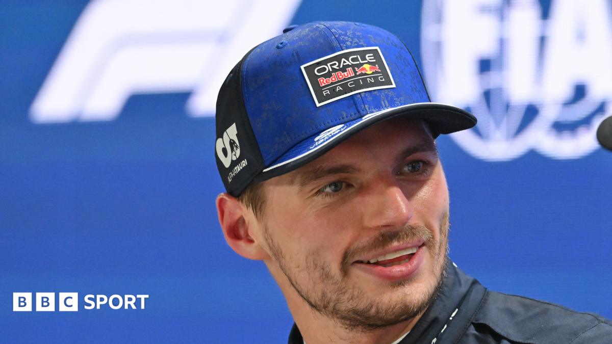 Max Verstappen smiling after taking pole position for the Singapore Grand Prix