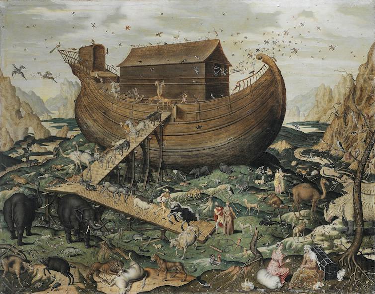 A large wooden ship surrounded by animals and people, mostly in pairs.