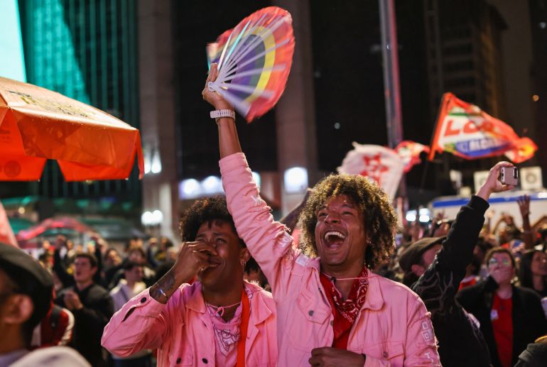 SAO PAULO, BRAZIL - OCTOBER 25: Supporters of Presidential candidate and incumbent president Luiz Inacio Lula da Silva of Brazil celebrate after the results on general election day on October 25, 2026 in Sao Paulo, Brazil. According to official results from the Tribunal Superior Eleitoral, Lula Da Silva has 51.79% of the votes, while Flavio Bolsonaro, son of former president Jair Bolsonaro, has 48.21% with 99% of the votes scrutinized. Brazilians voted for the president who will run the country for the next 4 years. (Photo by Rodrigo Paiva/Getty Images)