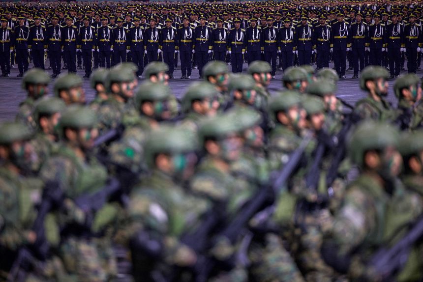 Members of the Saudi security forces take part in a military parade in Mecca on May 21, 2026.