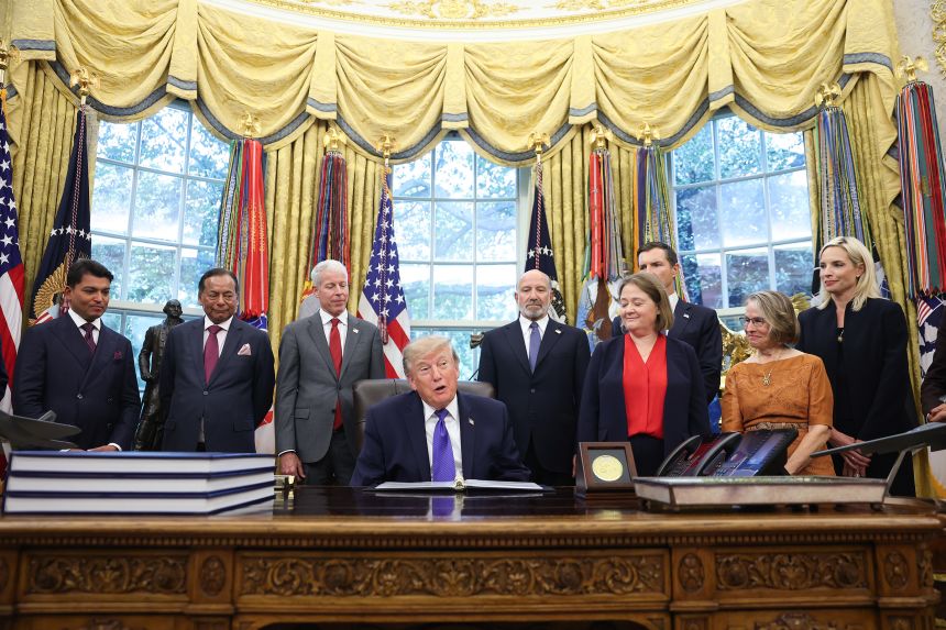 Rep. Ashley Hinson, far right, attends an Oval Office announcement from President Donald Trump on September 28.
