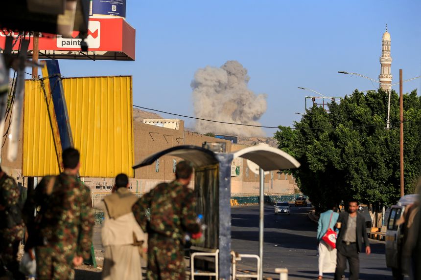 A plume of smoke rises during a reported airstrike by the Saudi-led coalition on the Houthi-controlled Yemeni capital Sanaa.