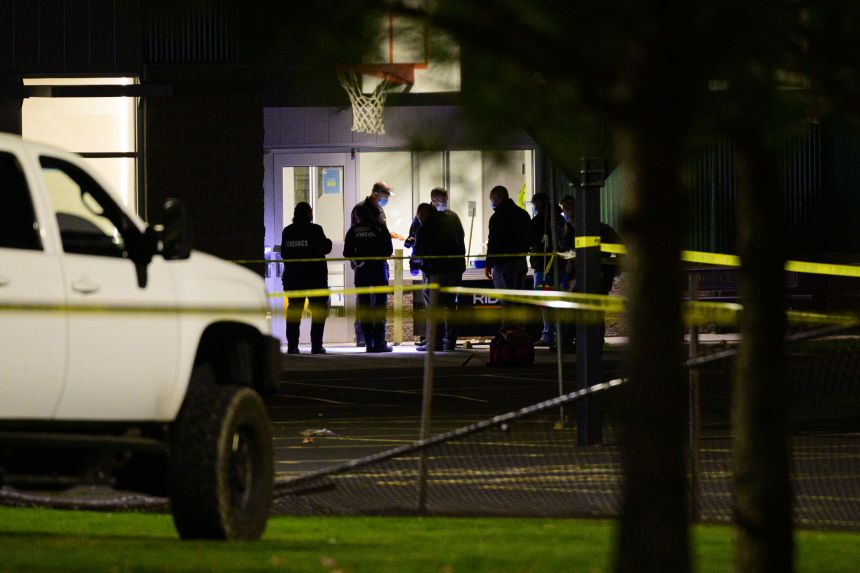 Crime scene investigators gather evidence at Silver Rail Elementary School on October 15.