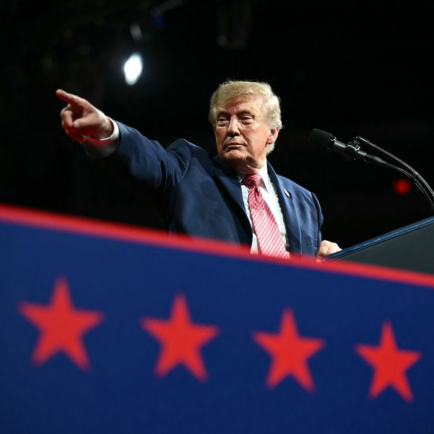 President Donald Trump points to a member of the crowd during a campaign rally in Park City, Kansas, on Monday.