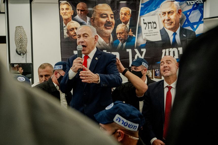Israeli Prime Minister Benjamin Netanyahu speaks to local residents and supporters during a campaign stop at HaTikva Market in Tel Aviv on Thursday.