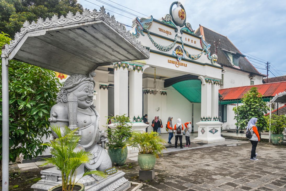 A Dwarapala, or guardian statue, watches over an entryway at the Kraton in Yogyakarta.
