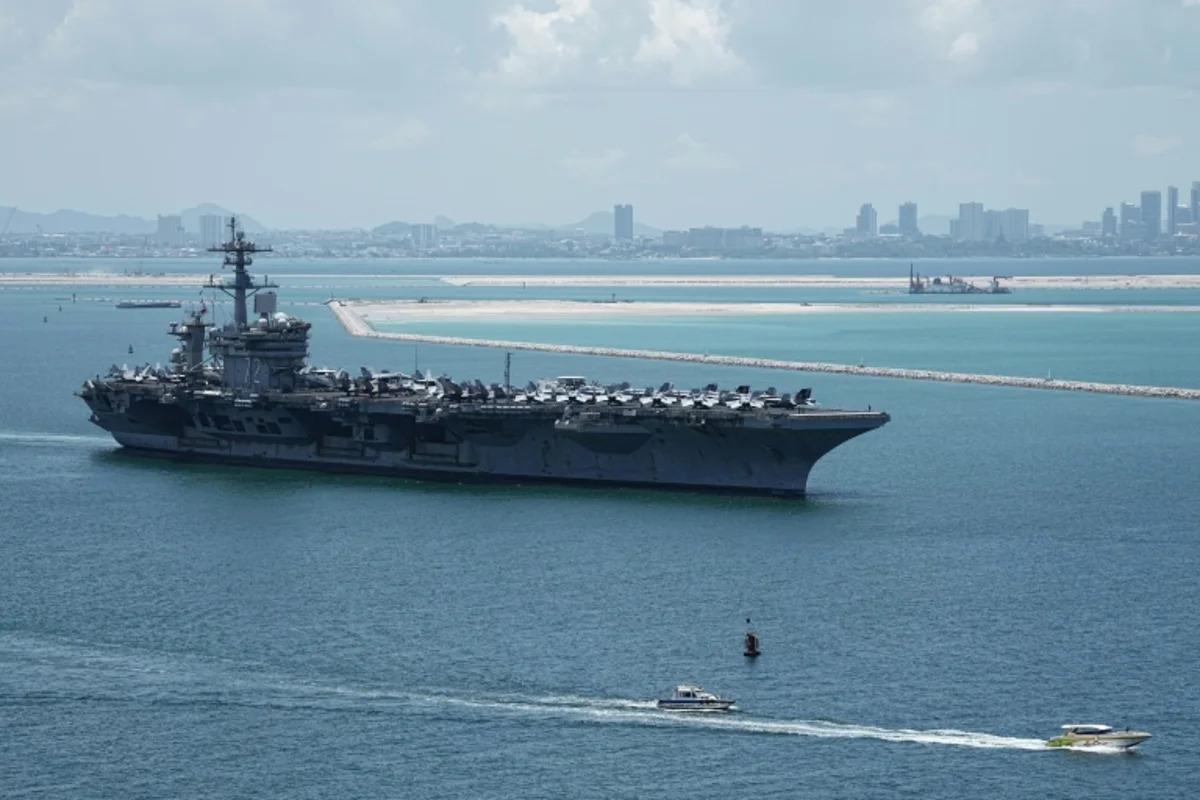 Pentagon chief visits carrier returning from tough Iran war deployment