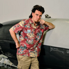 Palmer Luckey, 31, founder of Anduril Industries, stands in front of the Dive-LD, an autonomous underwater drone at company headquarters in Costa Mesa, Calif. Anduril recently won a U.S. Navy contract to build 200 of them annually.