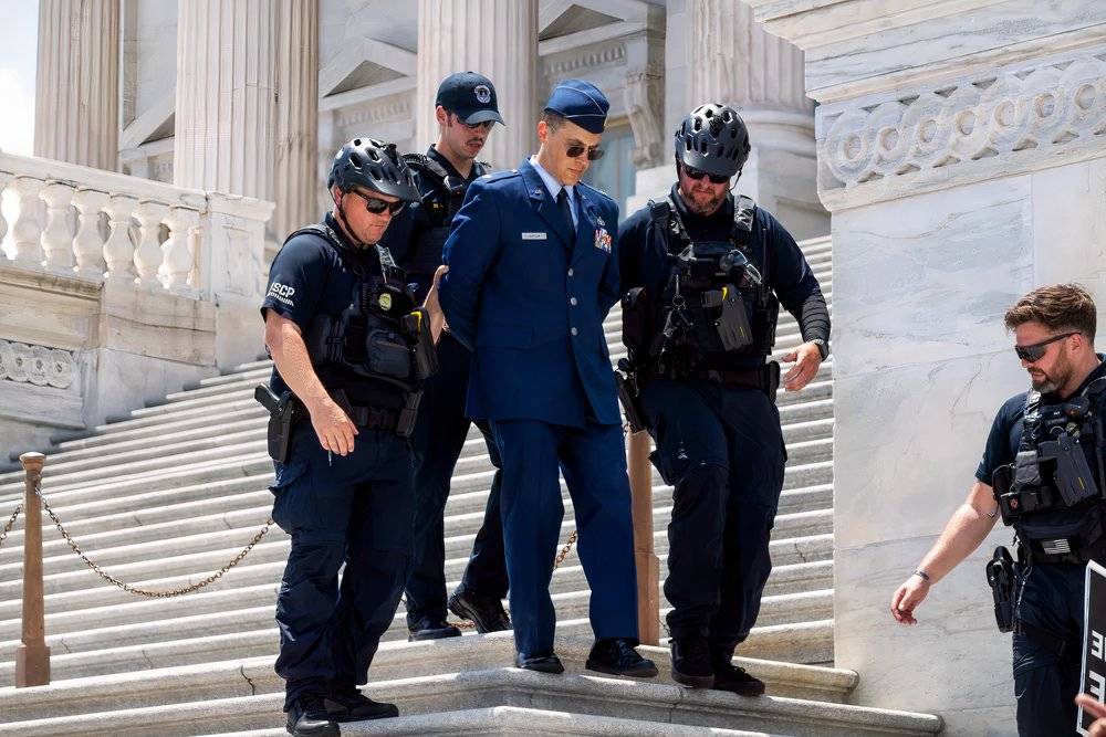 Air Force Major Who Called for Trump’s Impeachment is in Solitary Confinement 24 Hours a Day: Attorney