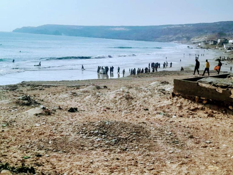Fishermen and local fishing boats along the shore in Bander Beyla, on Somalia’s Puntland coast.