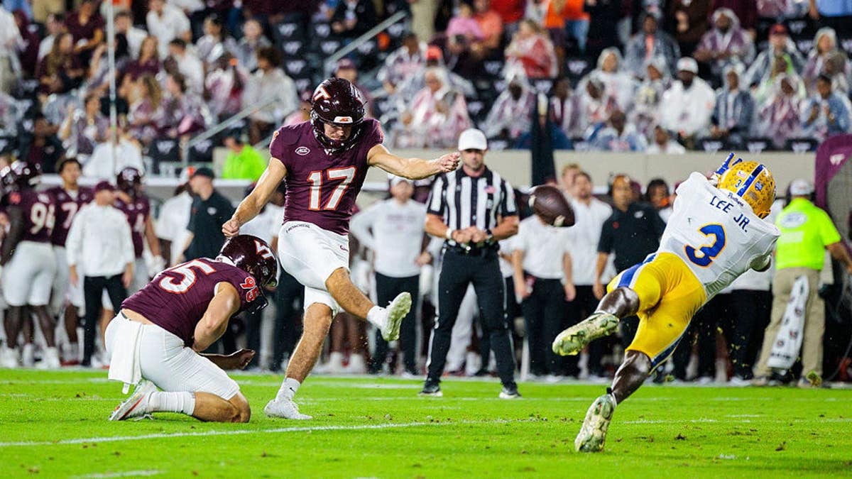 John Love kicks an extra point at Lane Stadium.