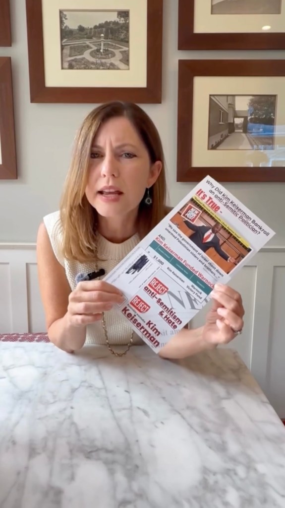 Kim Keiserman holds a mailer accusing her of funding anti-Semitic politicians.