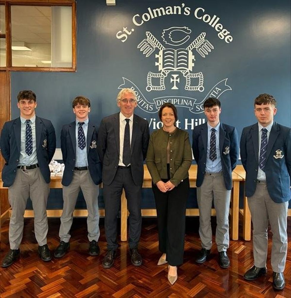 Minister Liz Kimmins is pictured with St Colman\u2019s College Principal Cormac McKinney and pupils during her visit to the school on Wednesday to discuss the introduction of Graduated Driver Licensing