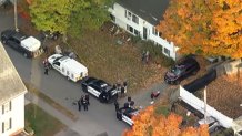Police outside the home in Reading, Massachusetts, where Andria Hanafin was found dead early on Thursday, Oct. 8, 2026.