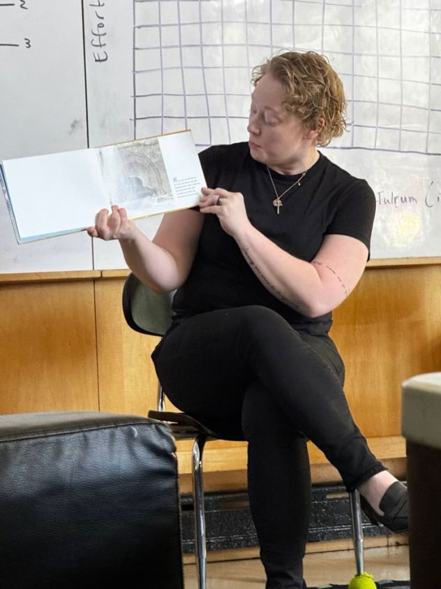 In this undated photo from the firm Romanucci & Blandin, LLC, Renée Good reads to children.