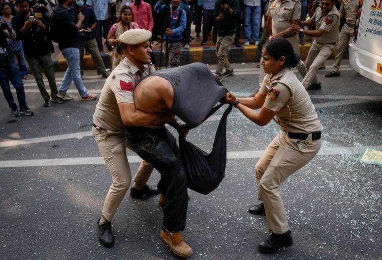 Security personnel detain a protestor during a protest by the Cockroach Janta Party (CJP) seeking the resignation of India's Chief Election Commissioner Gyanesh Kumar, in New Delhi, India, October 10, 2026. REUTERS/Adnan Abidi
