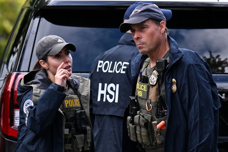 Agents of the Homeland Security Investigations (HSI) work outside the residence of US Rep. Ilhan Omar (D-MN), after US authorities conducted a raid as part of an ongoing investigation by the Justice Department, in Washington, DC, US, October 12, 2026. REUTERS/Annabelle Gordon