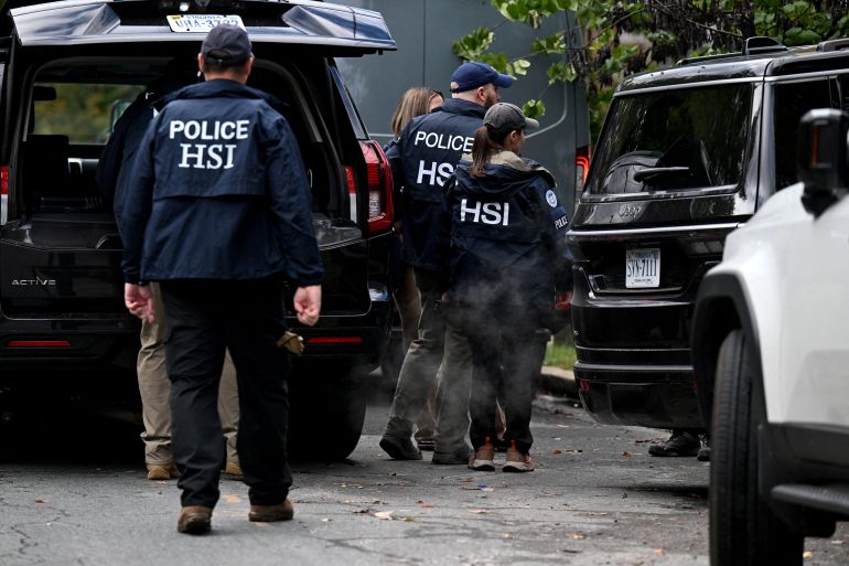 Agents of the Homeland Security Investigations (HSI) work outside the residence of US Rep. Ilhan Omar (D-MN), after US authorities conducted a raid as part of an ongoing investigation by the Justice Department, in Washington, DC, US, October 12, 2026. REUTERS/Annabelle Gordon TPX IMAGES OF THE DAY