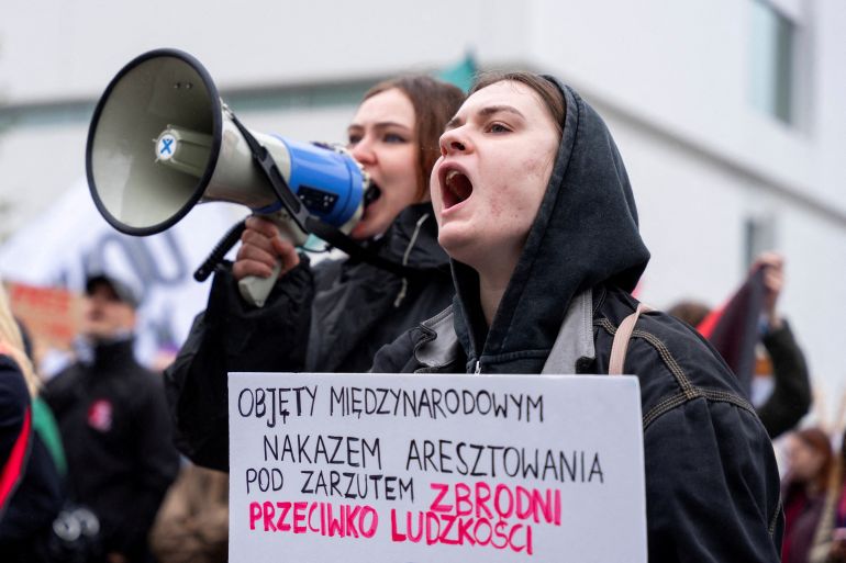 A protester shouts slogans, while holding a placard reading: "Wanted under international warrant for crimes against humanity" reffering to Israeli Prime Minister Benjamin Netanyahu, during a pro-Palestinian rally, as part of a global mobilisation action for Palestinians, amid events marking the third anniversary of the October 7, 2023 Hamas-led attacks on Israel and the subsequent war in Gaza, in Warsaw, Poland, October 10, 2026. REUTERS/Mateusz Kaczmarek