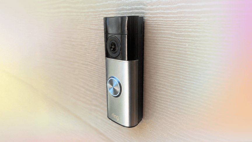 Ring's 2K doorbell on siding with CNET colors.