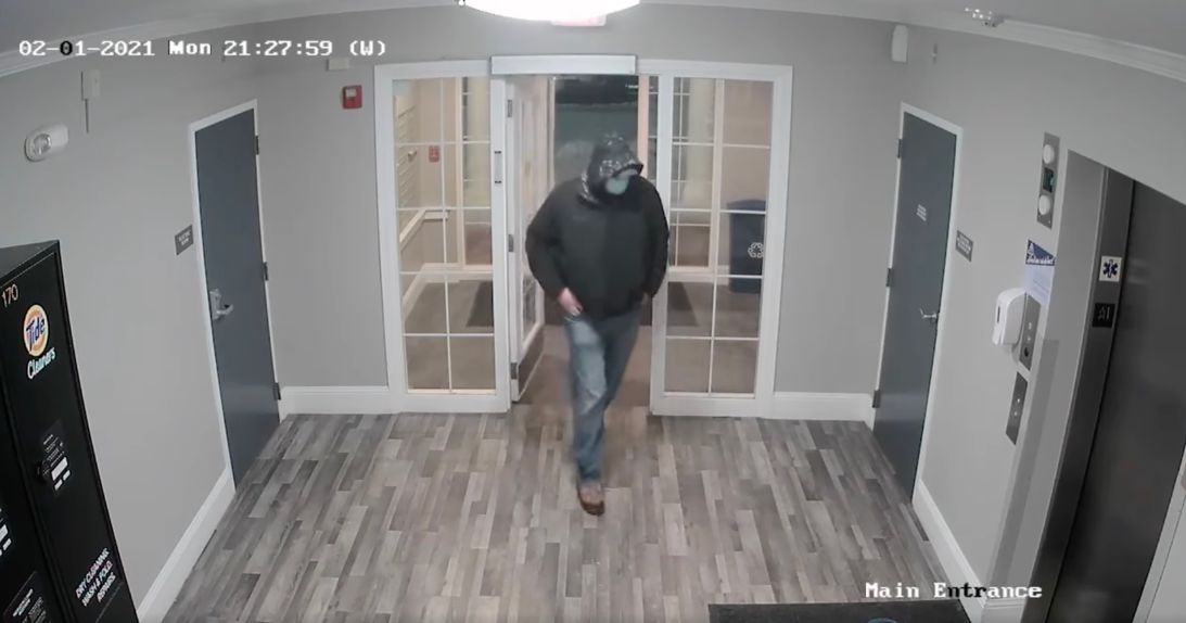 Surveillance video shows this hooded, masked man entering Sandra Birchmore's apartment building the evening of February 1, 2021 — the last day she was seen alive. Farwell’s attorneys do not deny he visited her apartment that evening but deny his involvement in her death.