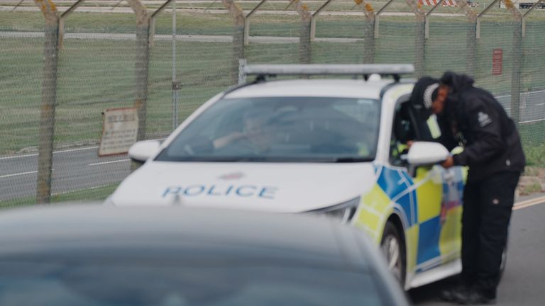 Police patrolling the perimeter of RAF Fairford. Pic: PA