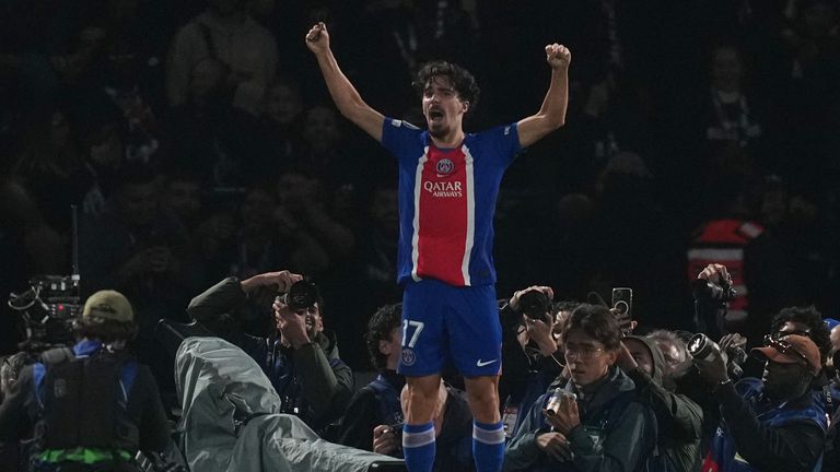 Vitinha celebrates in front of PSG fans after restoring lead