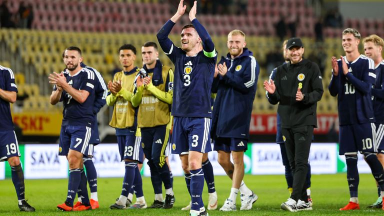 Andy Robertson applauds the Scotland fans at full time