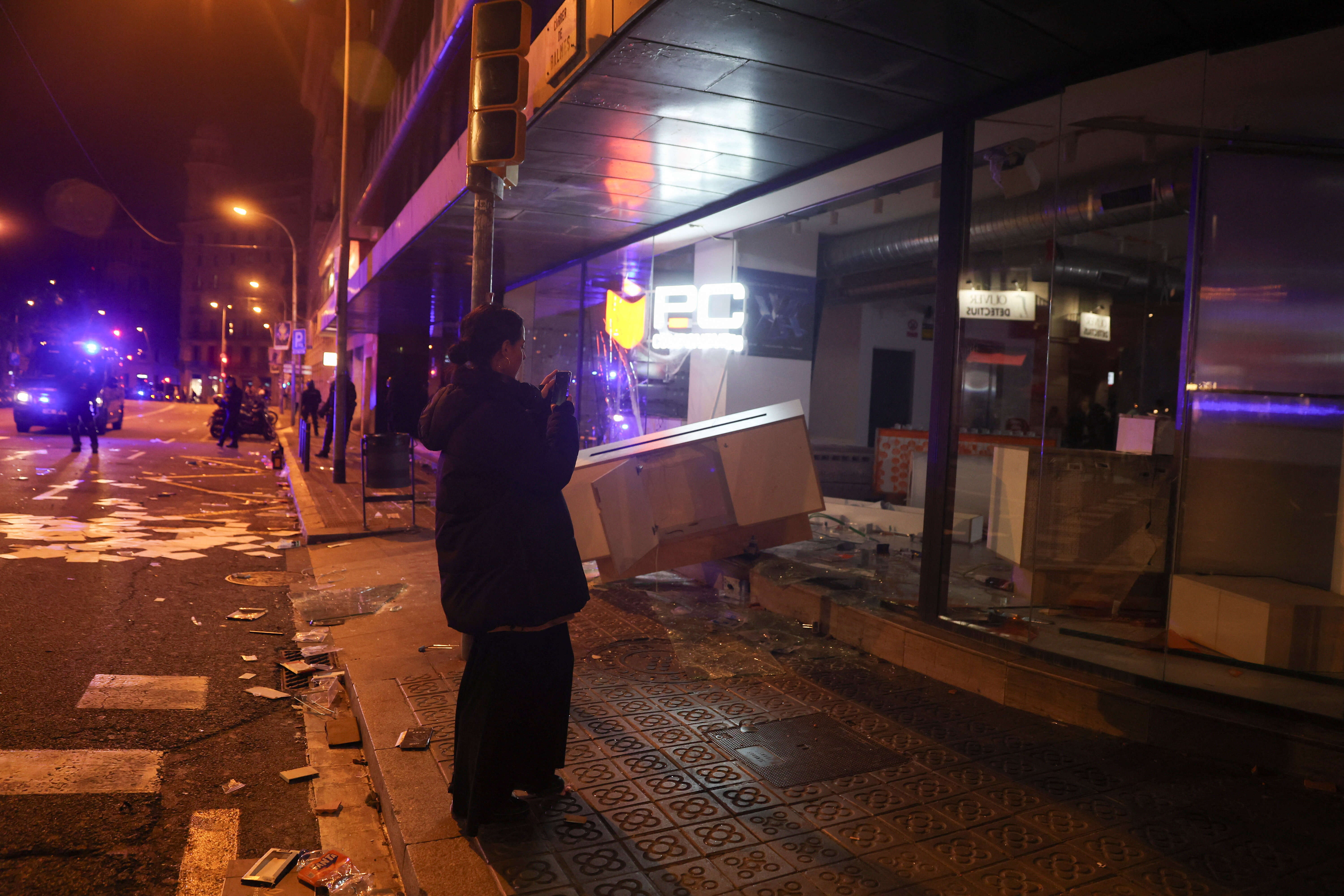 A vandalised store during a student's protest in Spain's Barcelona. Students protest in Barcelona