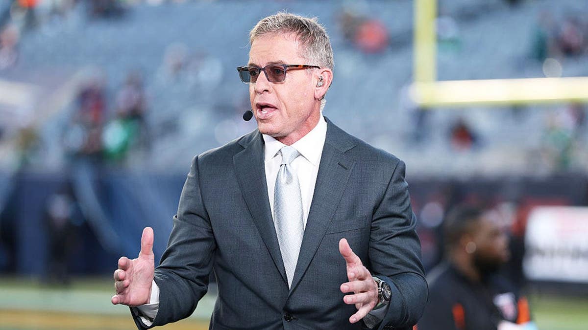 Troy Aikman looks on before the game at Soldier Field.