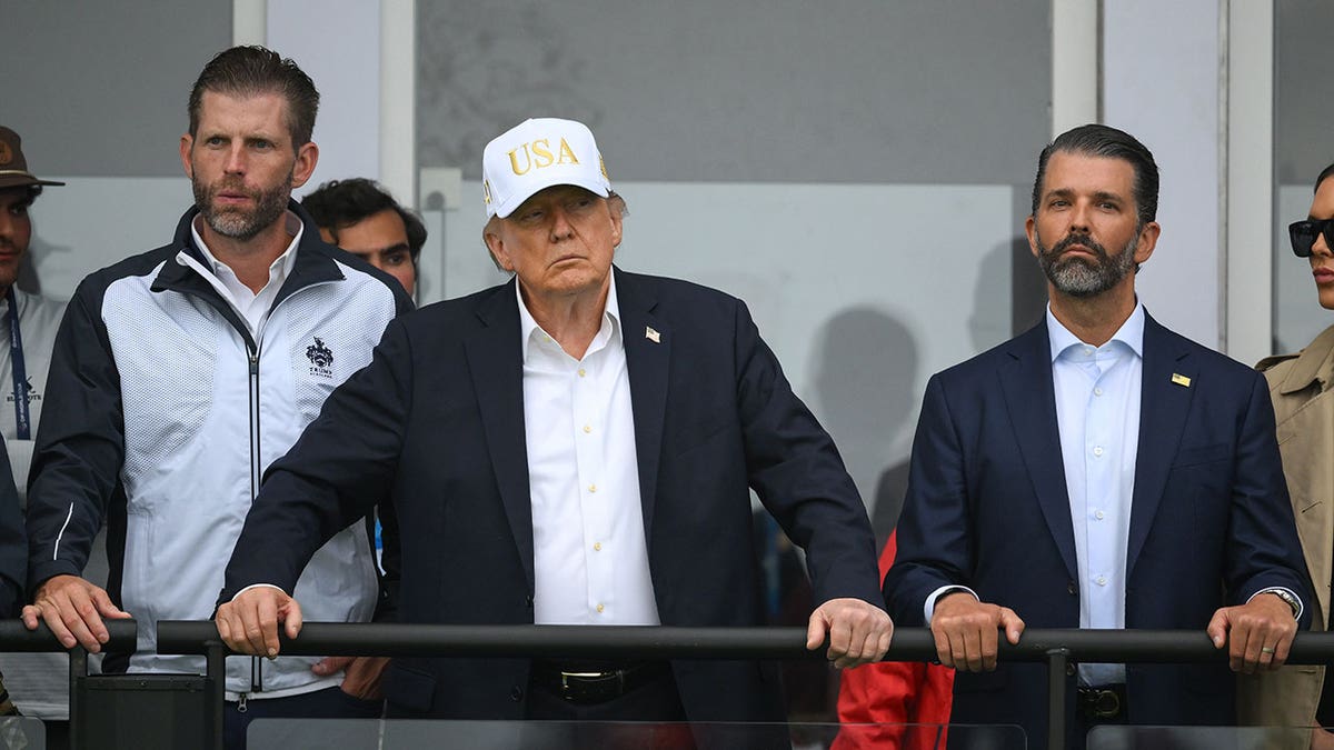 U.S. President Donald Trump, Eric Trump, left, and Executive Vice President of the Trump Organisation Donald Trump Jr, right, during day three of the Amgen Irish Open Golf Championship 2026 at Trump International Golf Links in Doonbeg, Clare.