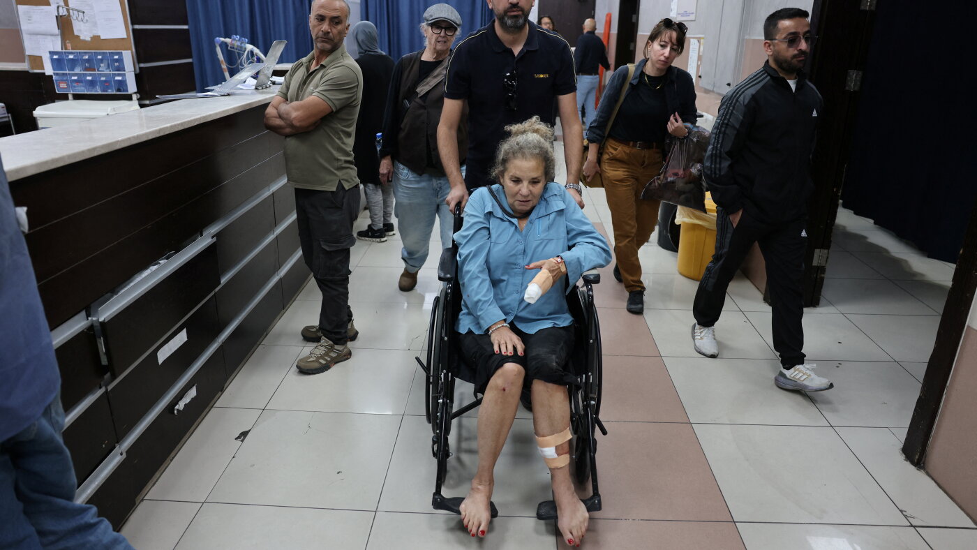 Israeli settlers beat Palestinians, U.S. photojournalist in West Bank : NPR