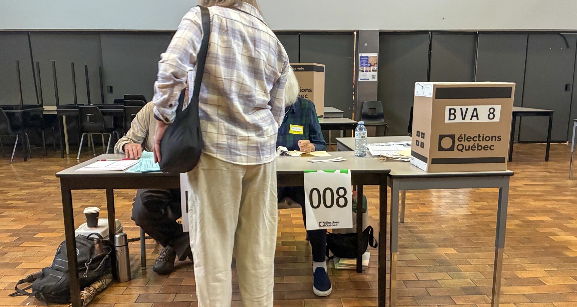 A woman casts a ballot in the 2026 Quebec general election