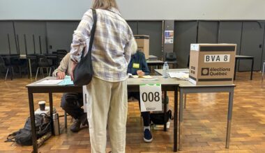 A woman casts a ballot in the 2026 Quebec general election