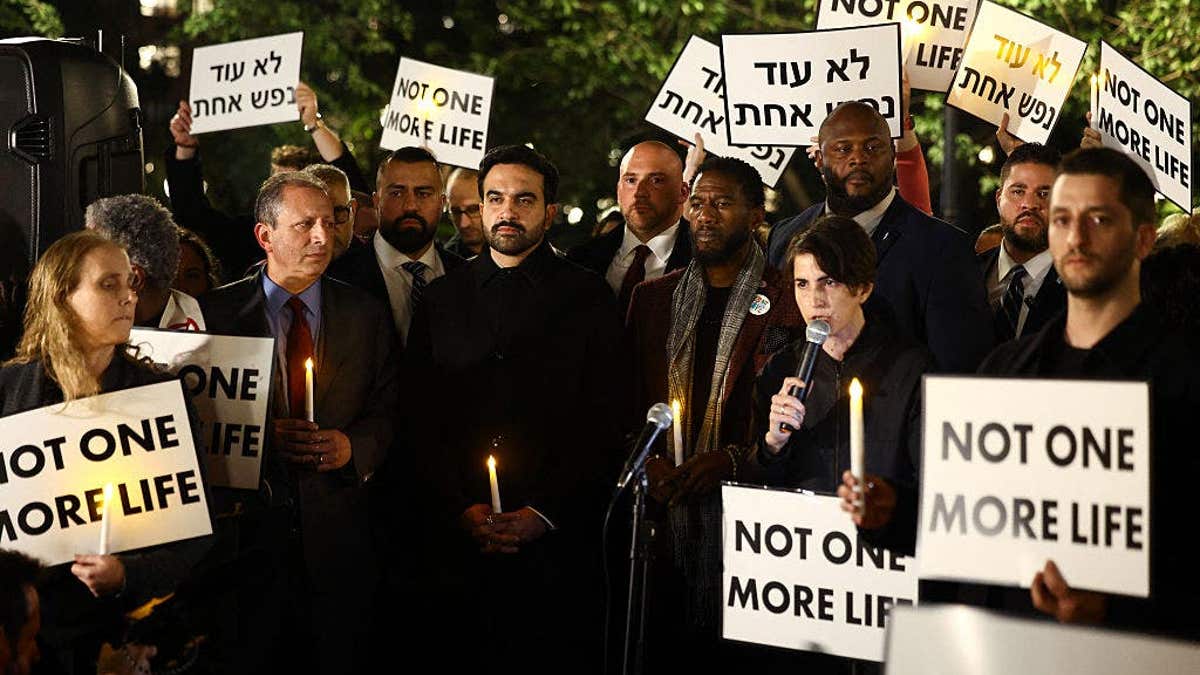 Zohran Mamdani stands during a rally in New York City
